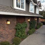 The four exterior wall sconces were added to illuminate the walkway in front of them. It is a wonder why the home was built without them.